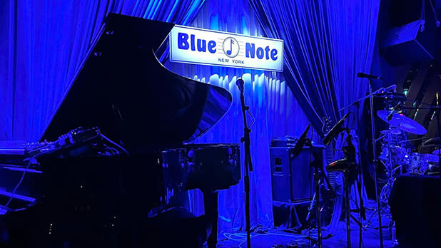 Stage backlit in blue at the Blue Note