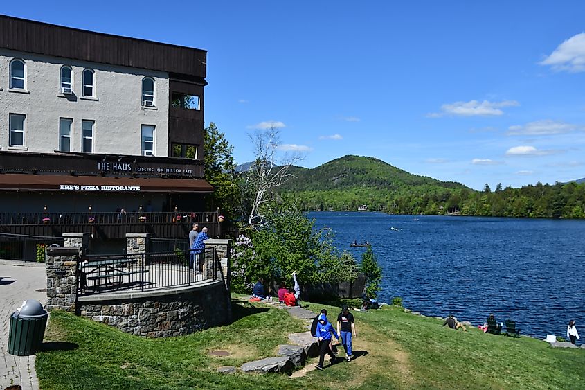 Visitors are enjoying a great time by the lake in Lake Placid, New York.