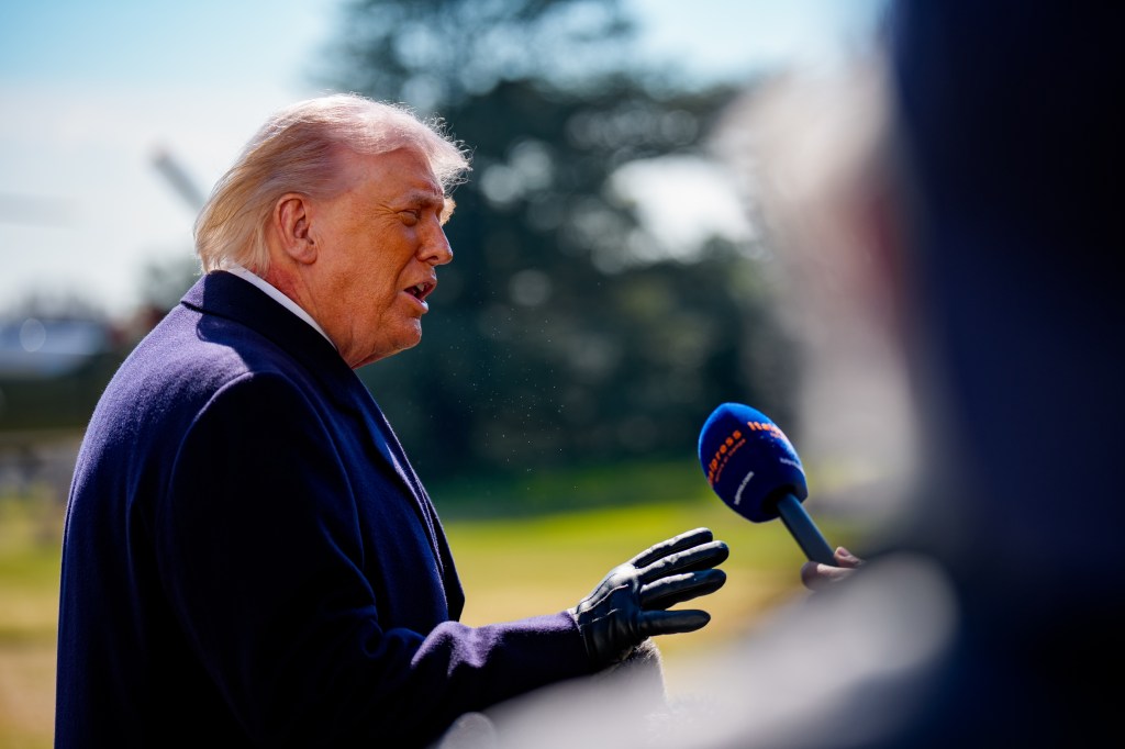 President Donald Trump speaks to media before departing Washington.