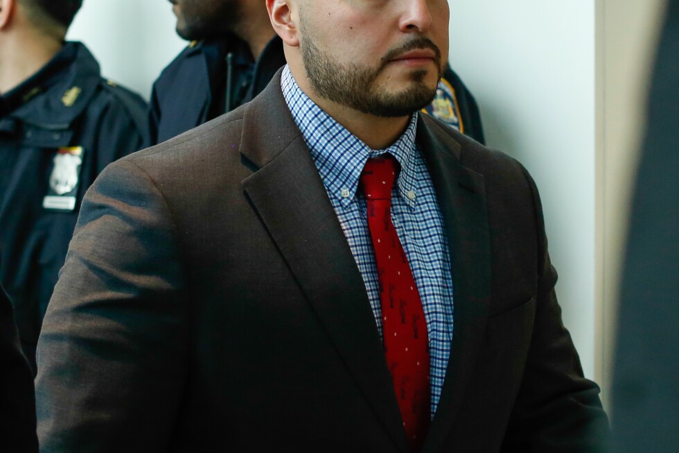 New York City police officer convicted in cooler throwing death