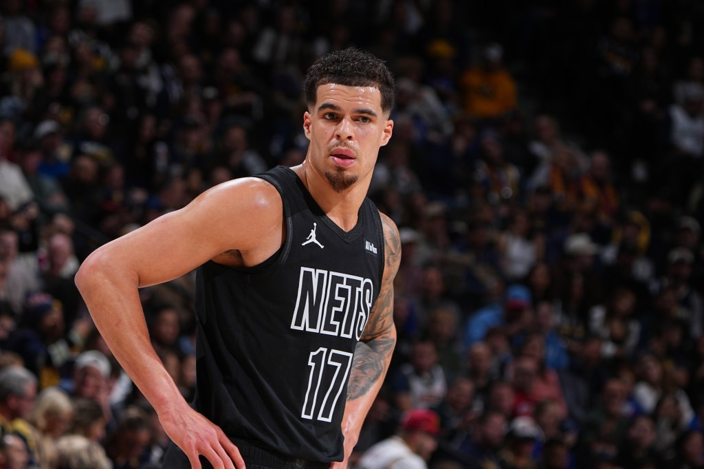 Michael Porter Jr. wearing a black Brooklyn Nets jersey with number 17.
