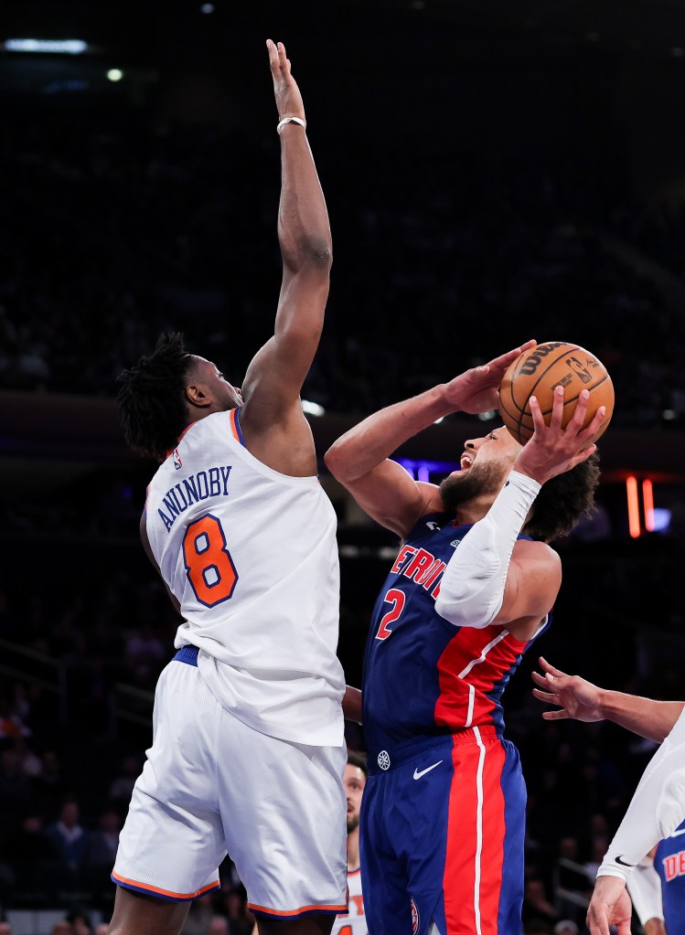Cade Cunningham attempts to shoot against Og Anunoby.