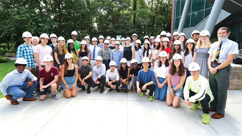 Image of summer engineering students with Dr. Saukin