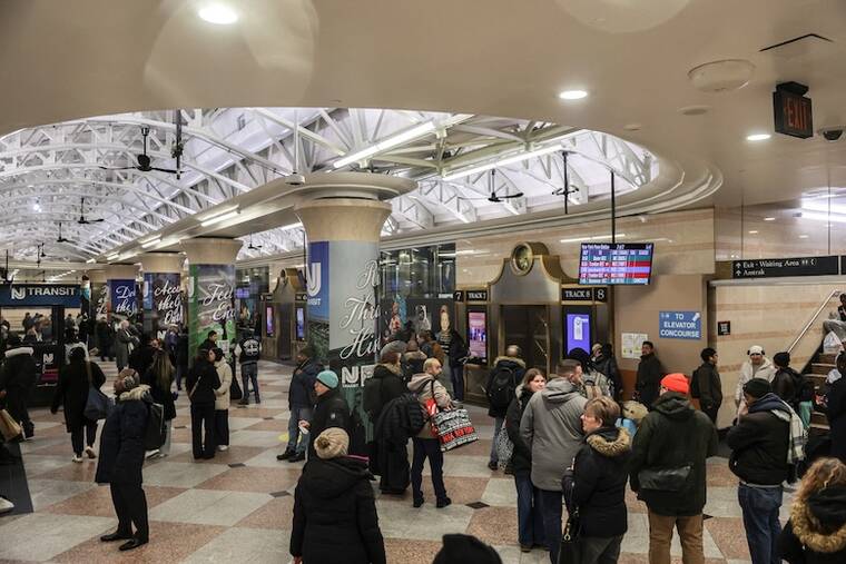 REUTERS/JEENAH MOON
                                Commuters wait as some NJ Transit trains are canceled or delayed due to a winter storm at Pennsylvania Station in New York City.