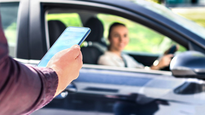 Person being picked up on a rideshare app