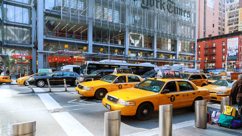 New York Ford Crown Victoria yellow cabs and limousines waiting at dispatching center