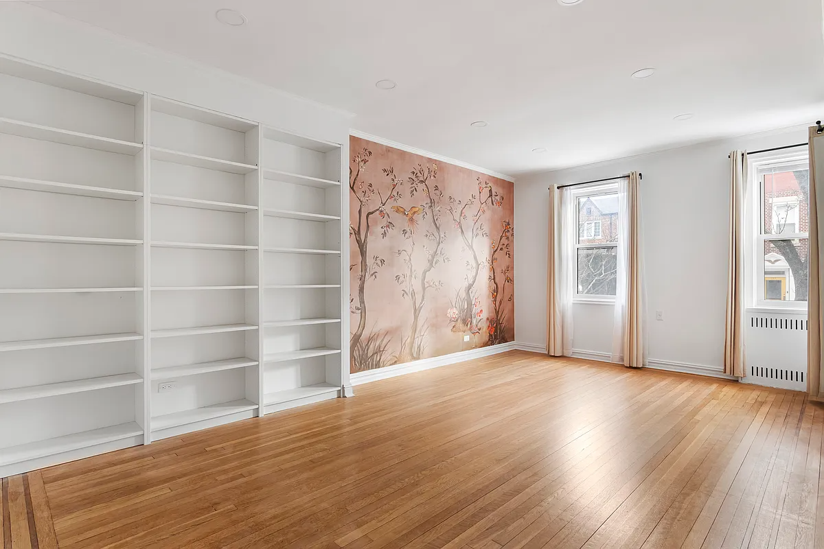 living room with modern built-ins, two windows
