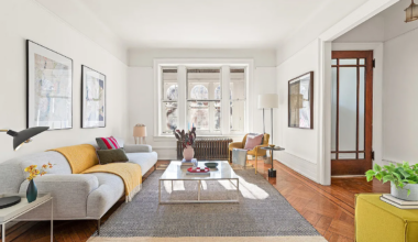 living room with wood floor, white walls