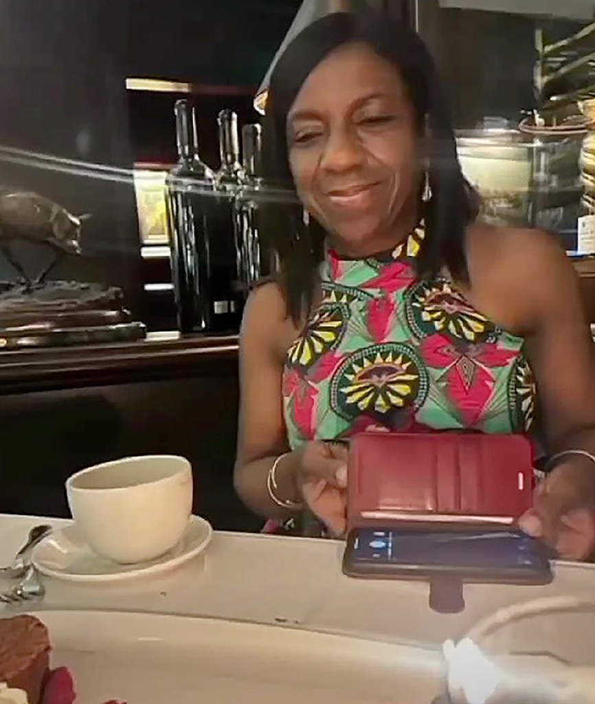 Judge Vivienne E. Gordon-Uruakpa looking at her phone.