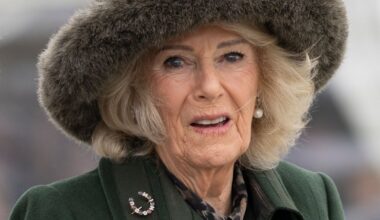 Queen Camilla wearing a green coat and fur hat