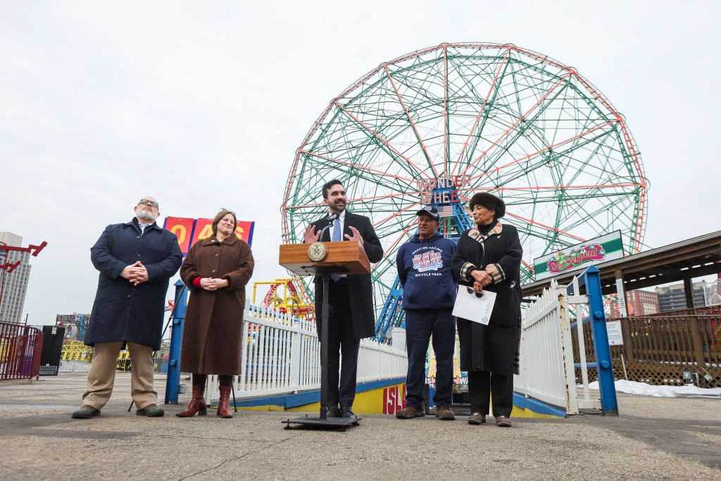 NYC Mayor Zohran Mamdani speaking at a press conference at Deno's Wonder Wheel Amusement Park.