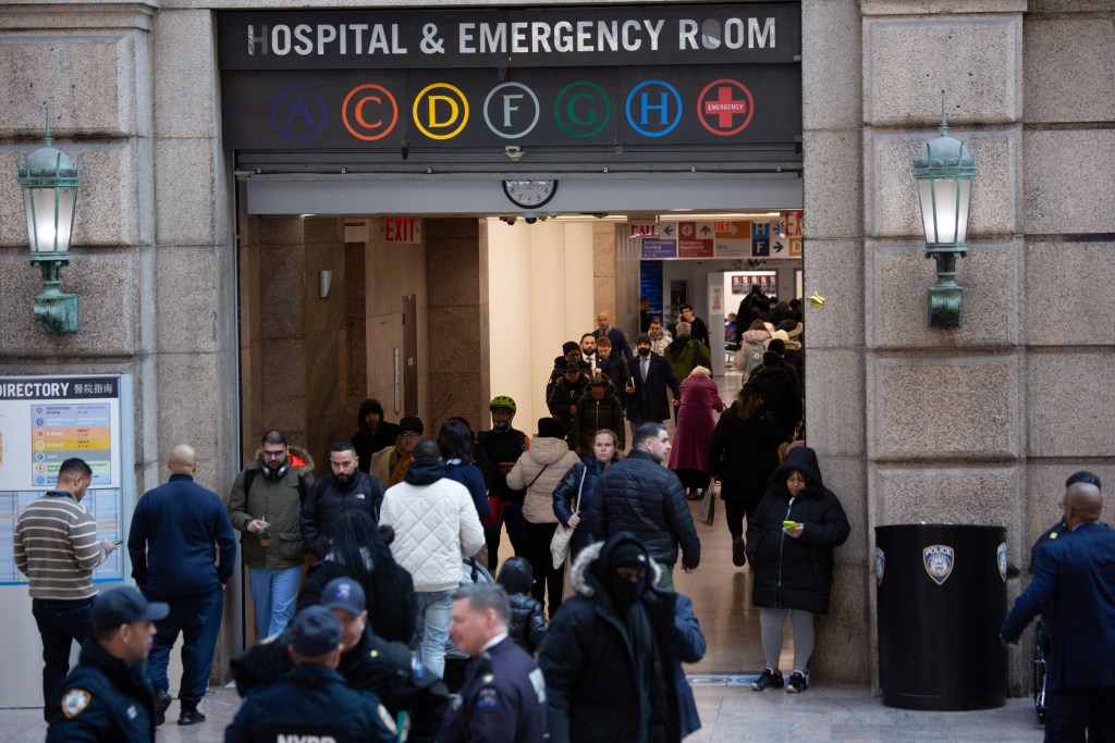 People enter and exit Bellevue Hospital’s main entrance.