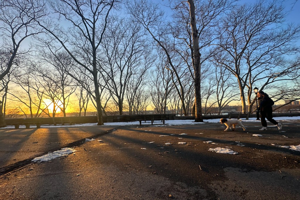 The sun sets over Riverside Park in Manhattan,