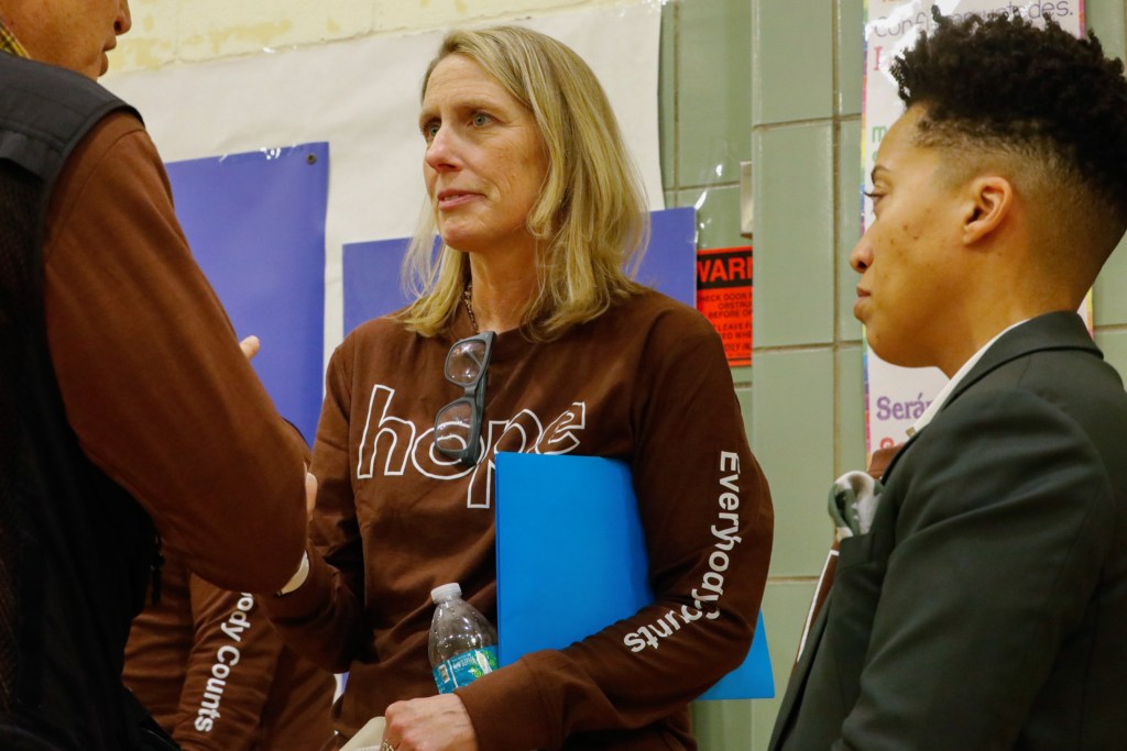 Department of Social Services Commissioner Erin Dalton speaks with volunteers preparing to help with the city’s annual homeless outreach survey,