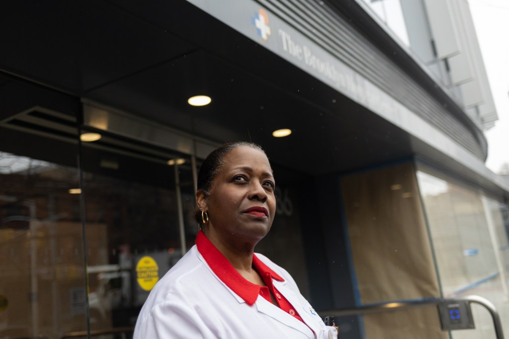 Brooklyn Hospital Center Certified Nurse Midwife Yvette Byer-Henry poses for a portrait in front a health center in Fort Greene.