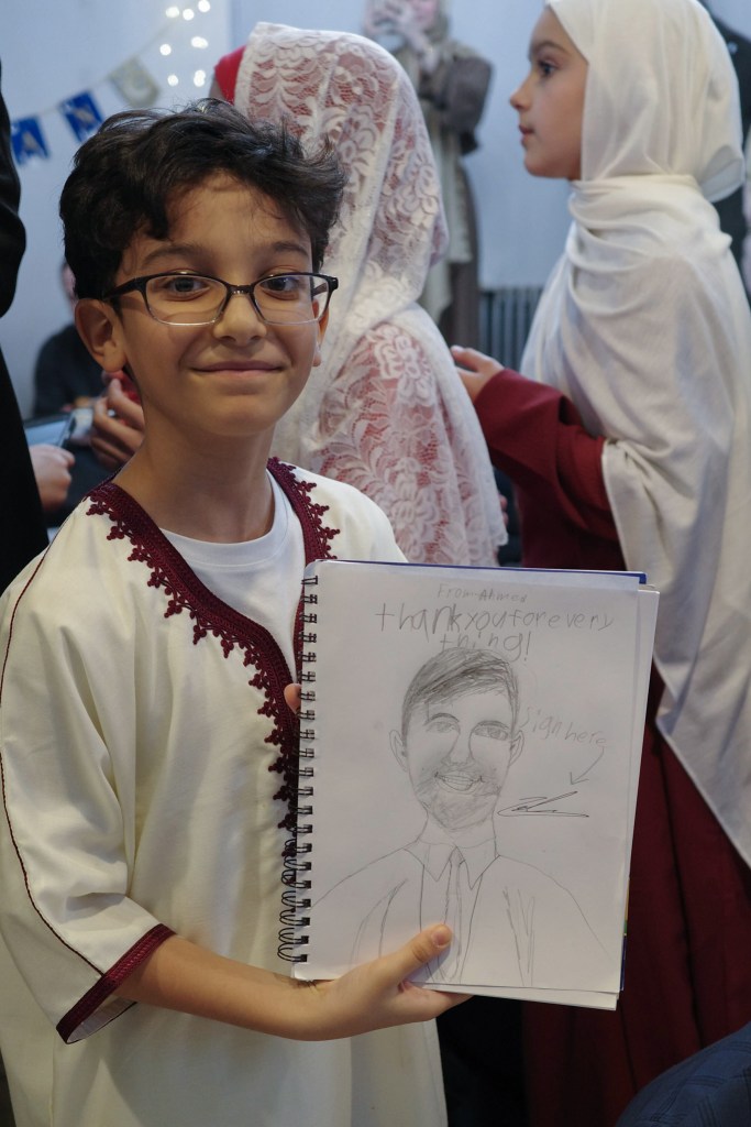 Ahmed had the mayor sign his portrait during an end of Ramadan celebration at the Masjid Islamic Unity and Cultural Center in Astoria, Queens,
