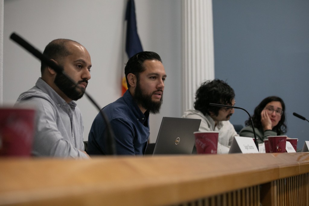 Rent Guidelines Board member Adán Soltren questions a research staff member during a Lower Manhattan meeting
