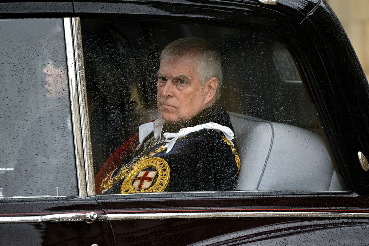 Andrew, then duke of York, is pictured leaving Westminster Abbey after his brother's coronation ceremony
