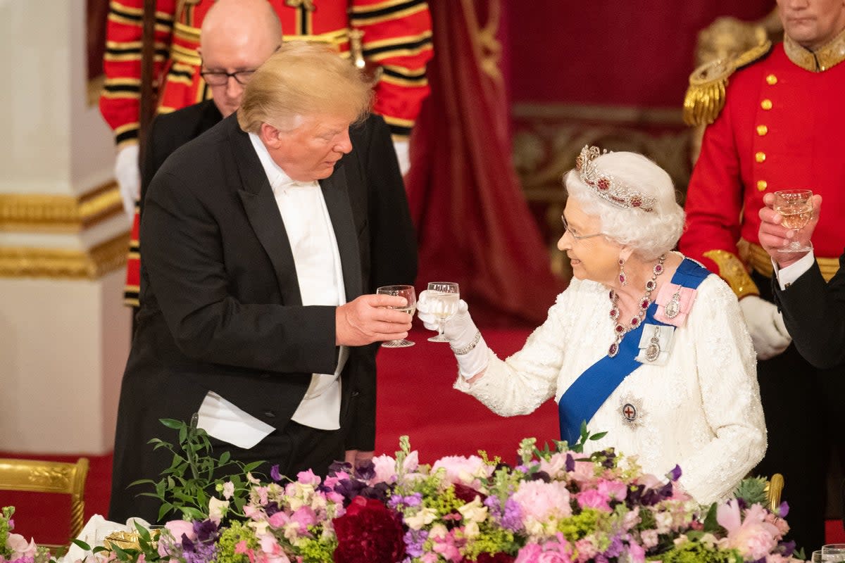 Britain's late Queen Elizabeth II raises glasses with US president Donald Trump during a state banquet at Buckingham Palace in 2019 (POOL/AFP via Getty Images)