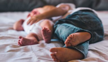 Two children on top of a bed