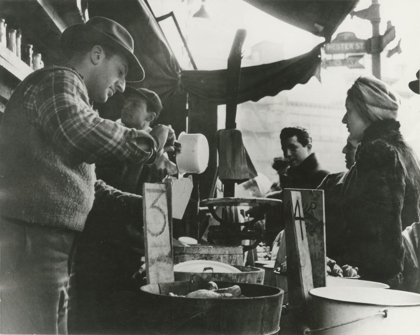 A Lower East Side pickle man serves customers. 