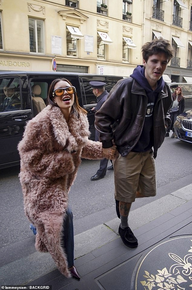 Jackie was in fits of laughter outside the hotel