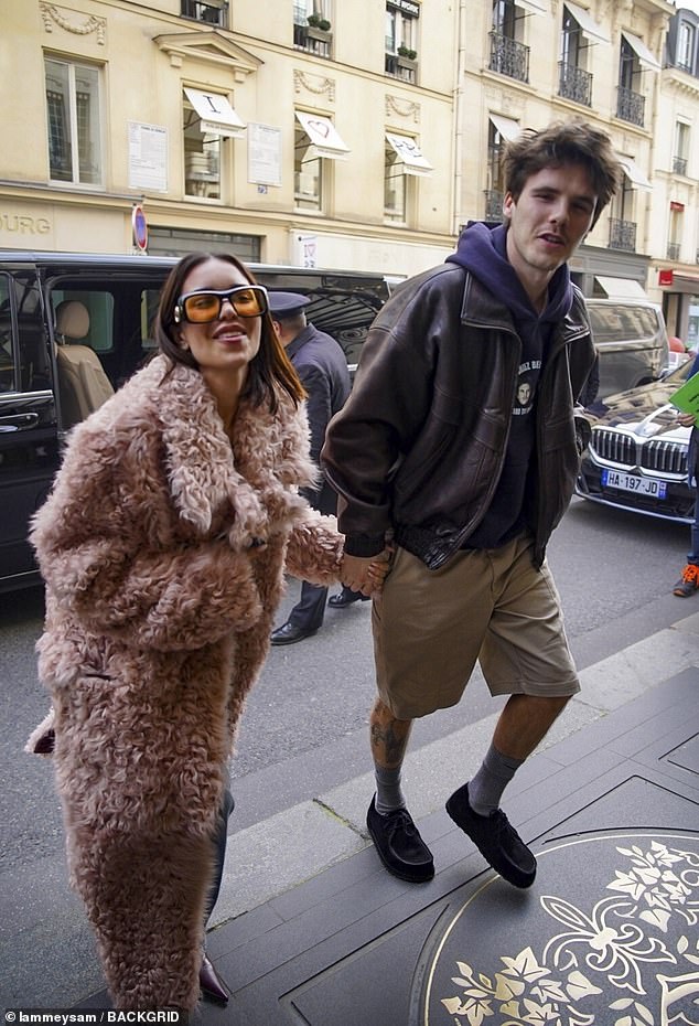 Cruz Beckham expressed his hopes at reconciling with his estranged older brother Brooklyn amid their bitter family feud when he was asked about him while out in Paris on Thursday