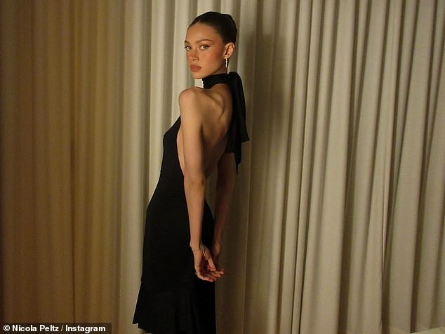 She then brushed off the drama by throwing a party for Brooklyn, where she looked incredible in a black halterneck gown that showcased her figure