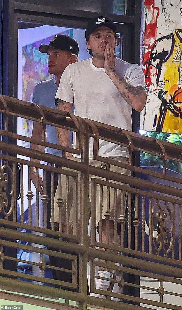 Brooklyn Beckham enjoyed dinner at Sushi Park in West Hollywood with singer Cody Simpson after missing out on an LA reunion with his dad David