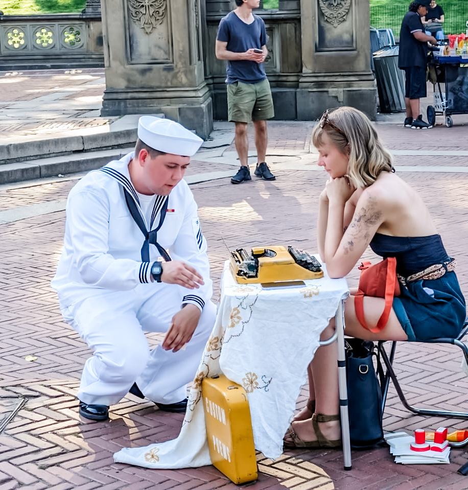 Zoe Branch interacts with a sailor.