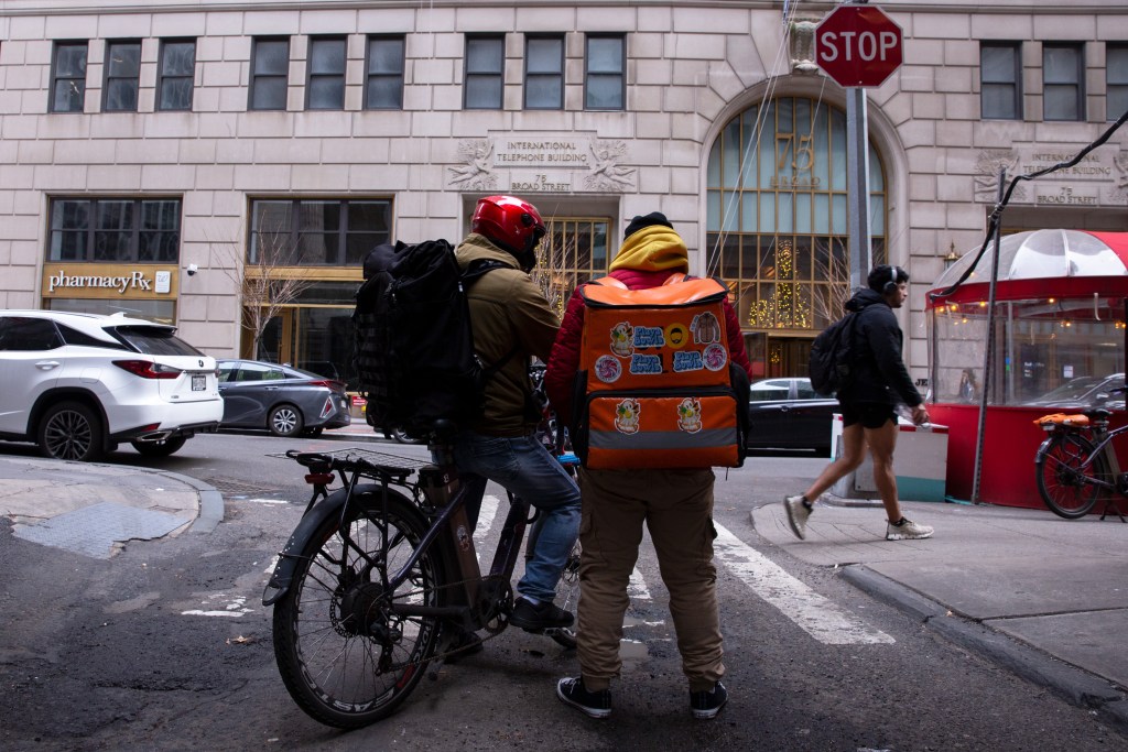 Delivery workers make the rounds in lower Manhattan.