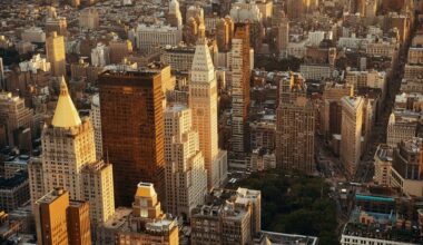 New York City rooftop view with downtown Manhattan skyscrapers and urban cityscape.