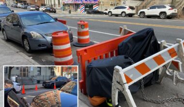 NYC parking wars has drivers saving spots with cones, Con Ed barriers and even derelict e-bikes