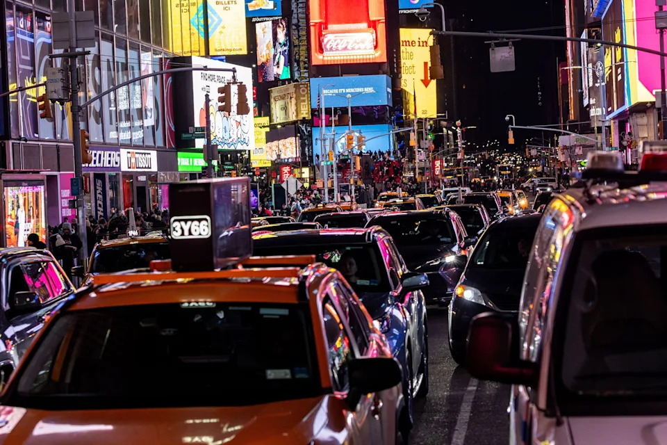 Alex Kent/Getty Images - PHOTO: Traffic moves along midtown Manhattan on Feb. 19, 2025, in New York.
