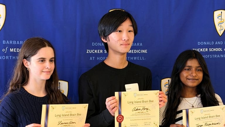 Adam Hong, center, took first place. Lauren Furer, left, and...