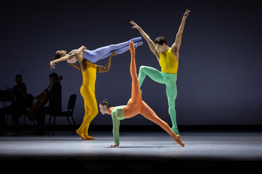 Four dancers appear on stage in bright colored costumes for Tiler Peck's “Thousandth Orange” 