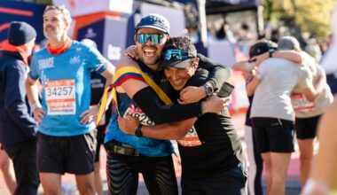 Two men hugging after finishing the 2025 TCS New York City Marathon.