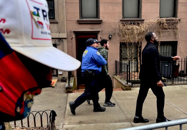 Police arrest a man on E. 87th St. in Manhattan after an incendiary device was thrown at far-right influencer Jake Lang and his supporters during a protest and counter-protest on the Upper East Side Saturday, March 7, 2026. (Rebecca White / New York Daily News) 