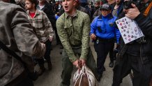 Right-wing influencer Jake Lang walks with a goat and supporters at a protest organized by the influencer on Saturday in New York City.