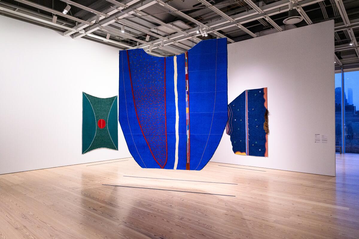 Art hangs in a museum.