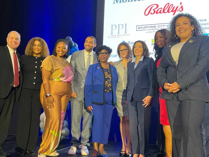 Left to right: State Comptroller Thomas DiNapoli, Assembly member Yudelka Tapia, Assembly member Chantel Jackson, State Sen. Jamaal Bailey Bronx District Attorney Darcel Clark, Bronx Chamber of Commerce CEO Lisa Sorin, Gov. Kathy Hochul, Bronx Borough President Vanessa Gibson, State Sen. Nathalia Fernandez
