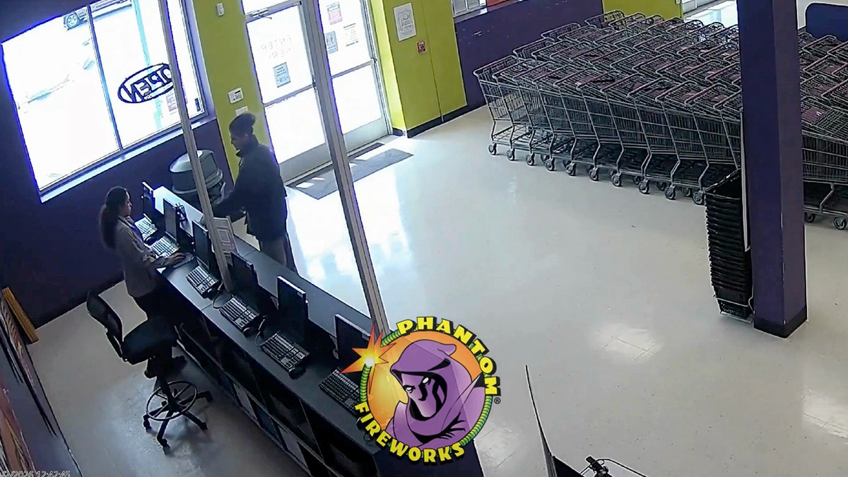 Emir Balat at the front counter of a fireworks store.