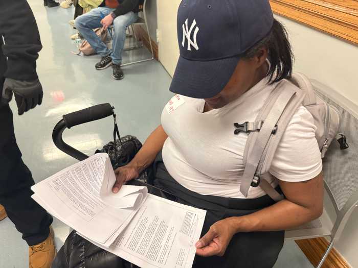 Sabrina Powell and her folder of legal documents, detailing her longstanding disputes with her landlord.