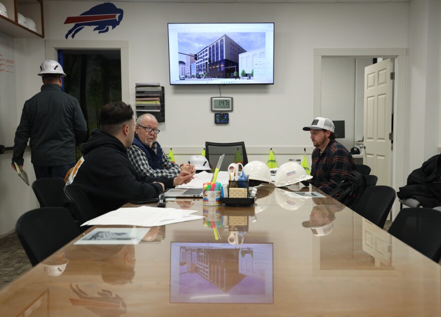 Building contractors meet to discuss demolition and the apartment buildout inside what was once office space being converted into the Gateway Apartments in Rochester, N.Y. The development will include studio, one- and two-bedroom units ranging from about 875 to 1,800 square feet—roughly the size of a modest three-bedroom house. The building sits midblock between St. Paul Street and North Clinton Avenue.