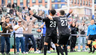 Brooklyn FC men players Juan Carlos Obregón Jr. and Peter Mangione celebrate with supporters after a goal at Maimonides Park.