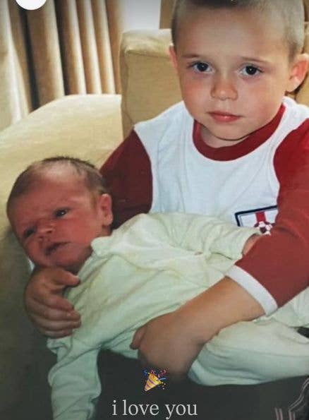 A young Brooklyn Beckham holding a baby Cruz Beckham