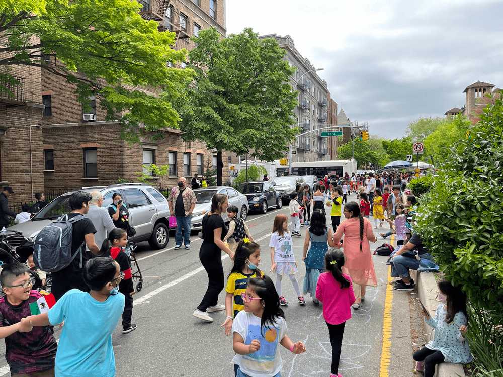 Students and parents enjoying car-free Open Streets