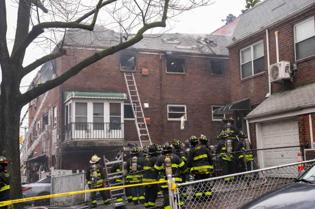 Three people were killed, including a child of unknown age, with several others suffering serious injuries, after a four-alarm fire broke out inside a two story residence at 44-49 College Point Boulevard in Queens on Monday March 16, 2026. 1309. (Theodore Parisienne / New York Daily News)