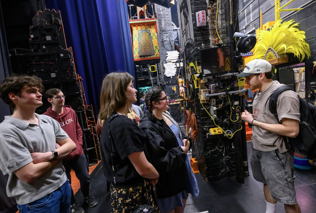 Students on a backstage tour of Broadway show