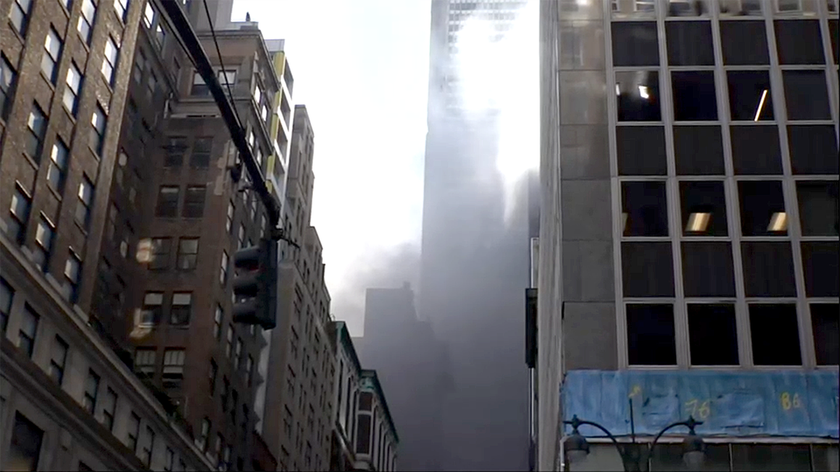 NYC rooftop fire with smoke in Midtown